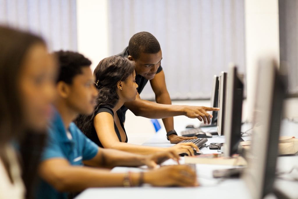Students studying and learning computer programming